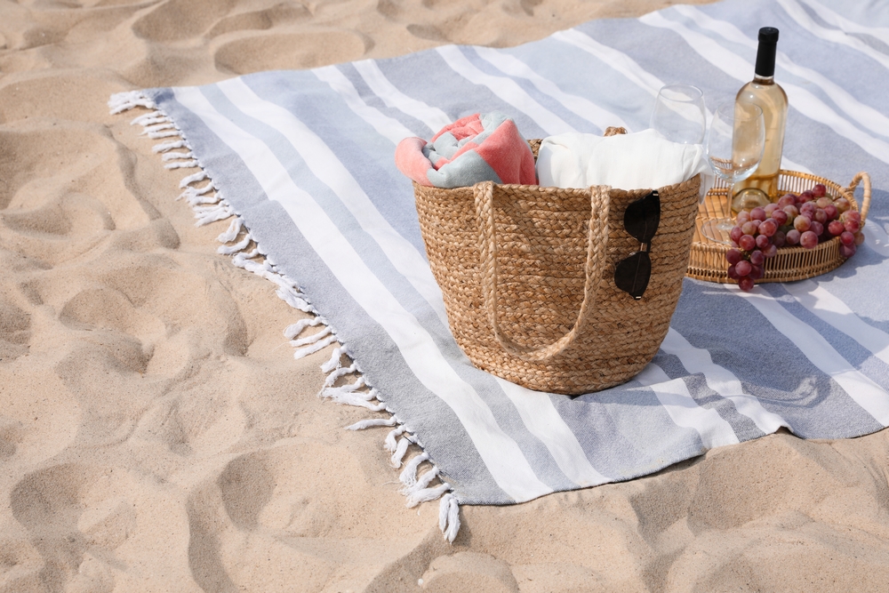 beach blanket with a picnic on it