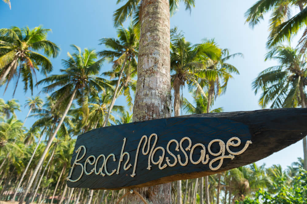 Beach massage sign written in rope