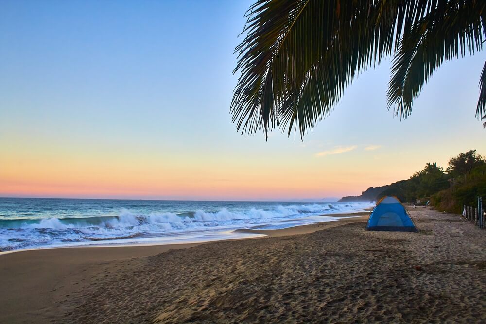 sunsetting on a Playa Malpaso with a tent 