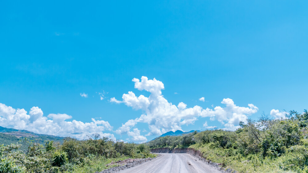 dirt road leading to mountains Ecuador