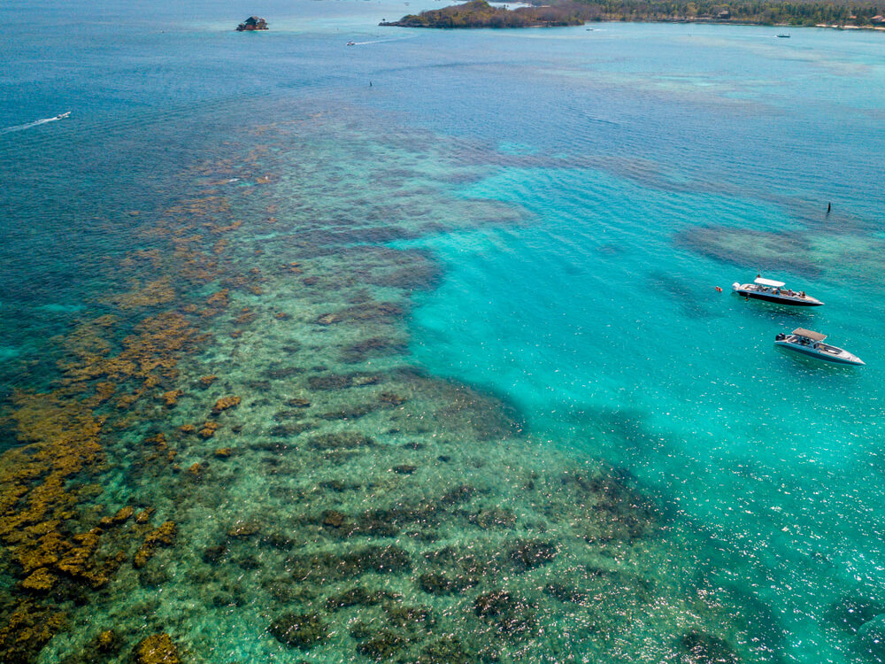 boats near the reef at Playa Blanca Colombia