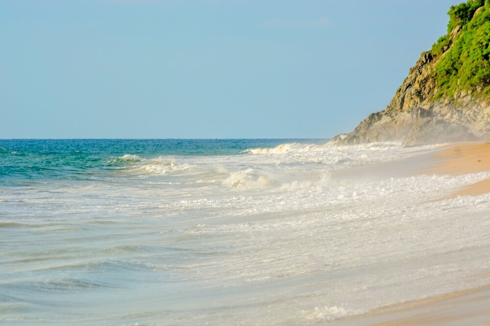 waves hitting the sandy shore of Playa Malpaso