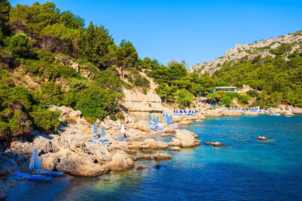 umbrellas and chairs in the rocks at Anthony Quinn Bay, Rhodes