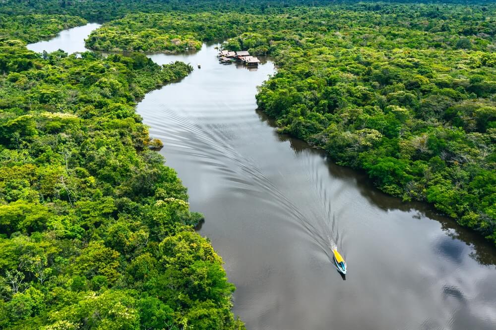 boat on the Amazon surrounded by jungle