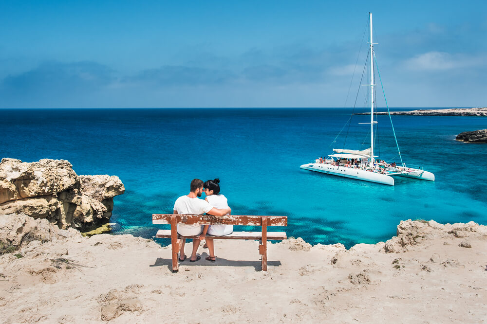 lovers looking t a catamaran in Greece