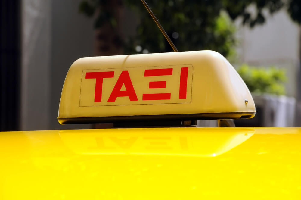 Taxi sign in Greek letters