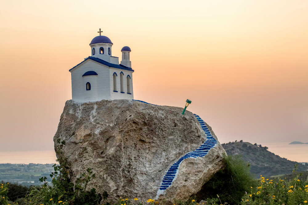 steps up to a church on a rock in the Greek Islands 