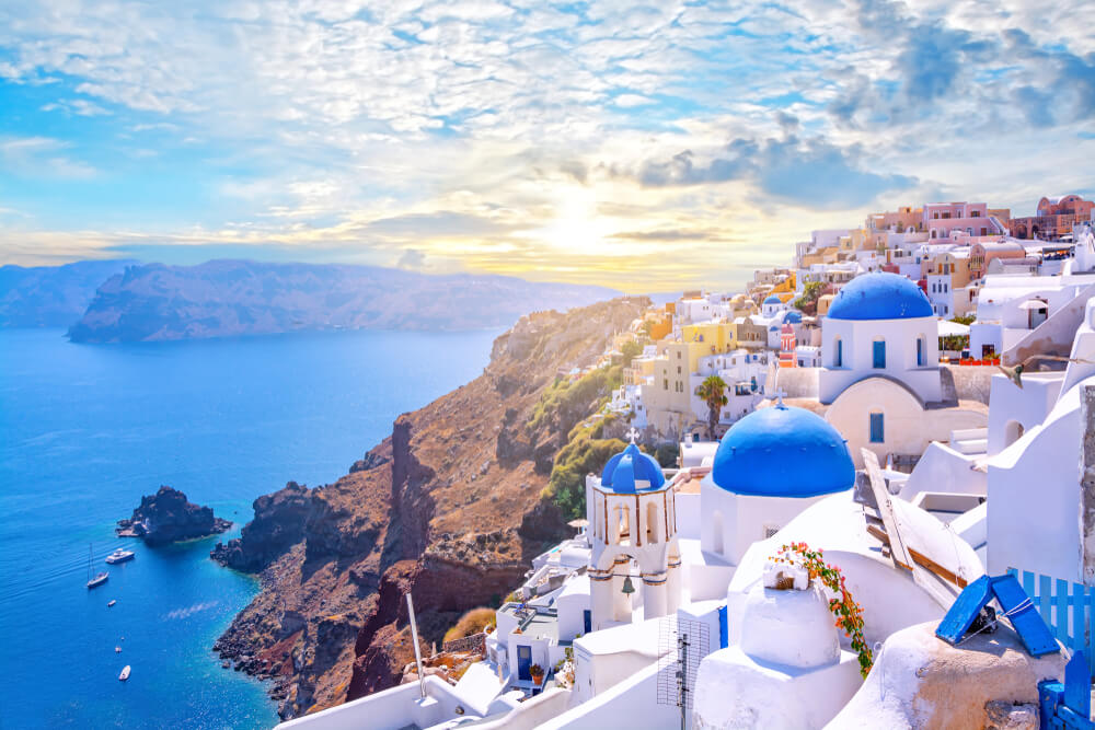 blue dome churches and white building of Santorini