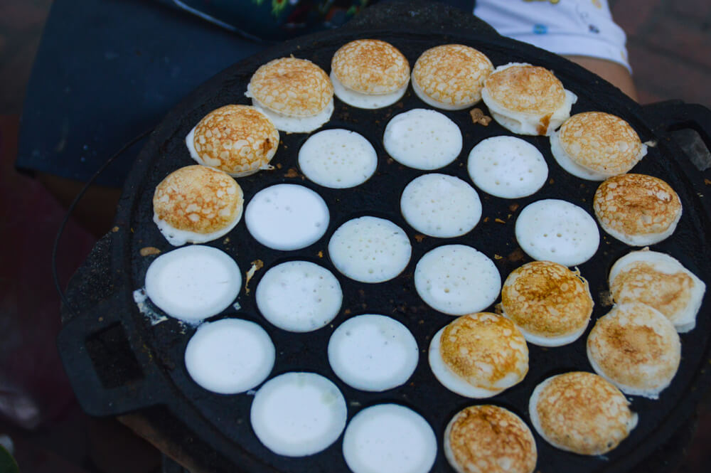 mini coconut pancakes street food in Laos