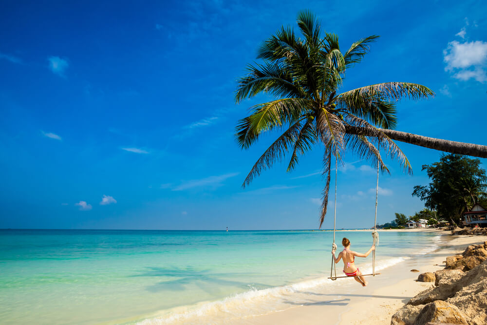 girl on a swing on a Koh Pha Ngan beach