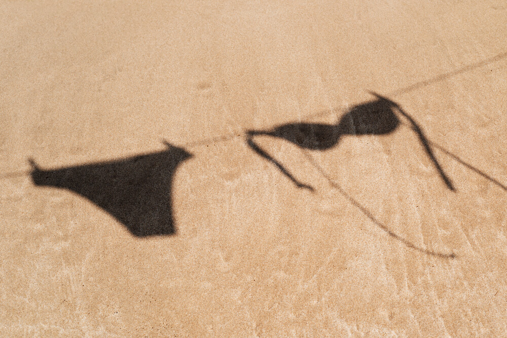 shadow of a bikini on the beach