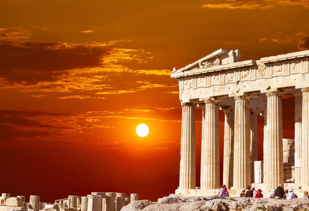 sunsetting in Greece with ruins in the foreground