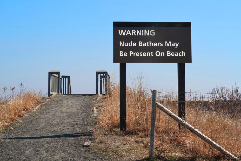 Warning sign for nude sunbathers