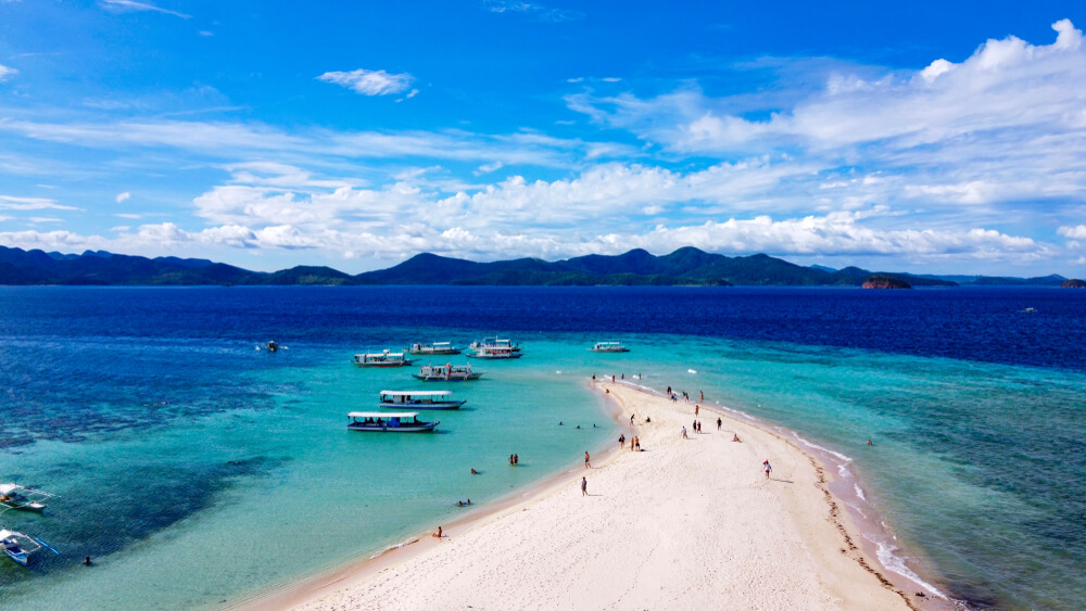 boats near a sand bar in the Philippines