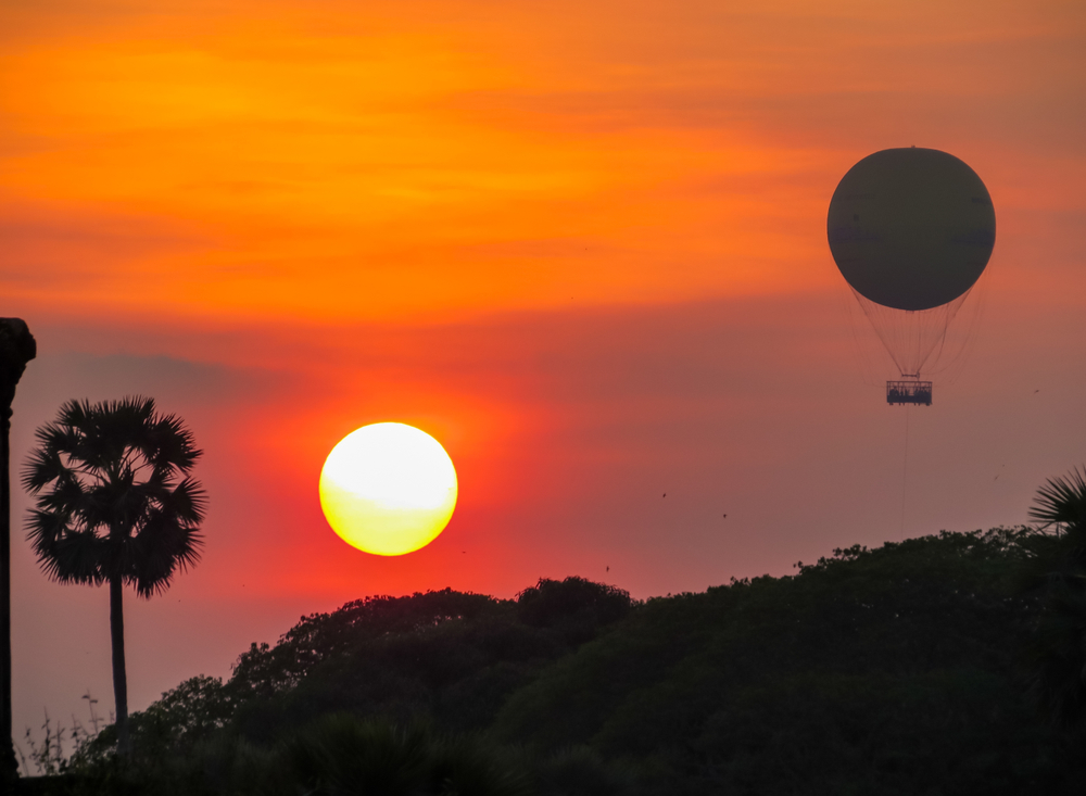 hot air balloon rides with orange sunset in Southeast Asia