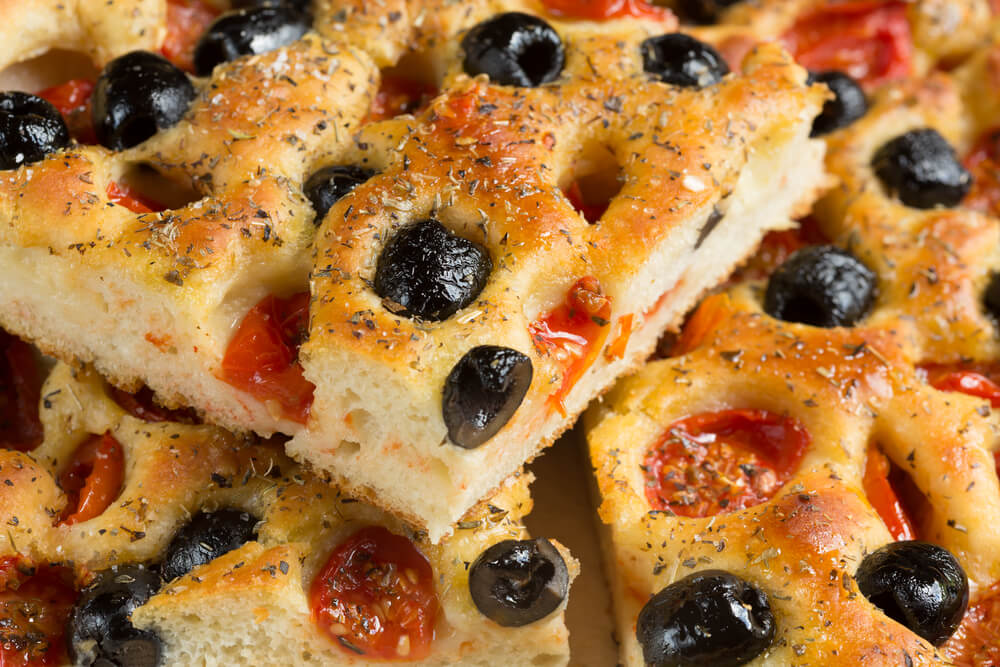 Focaccia Barese in Puglia with olives and tomatoes