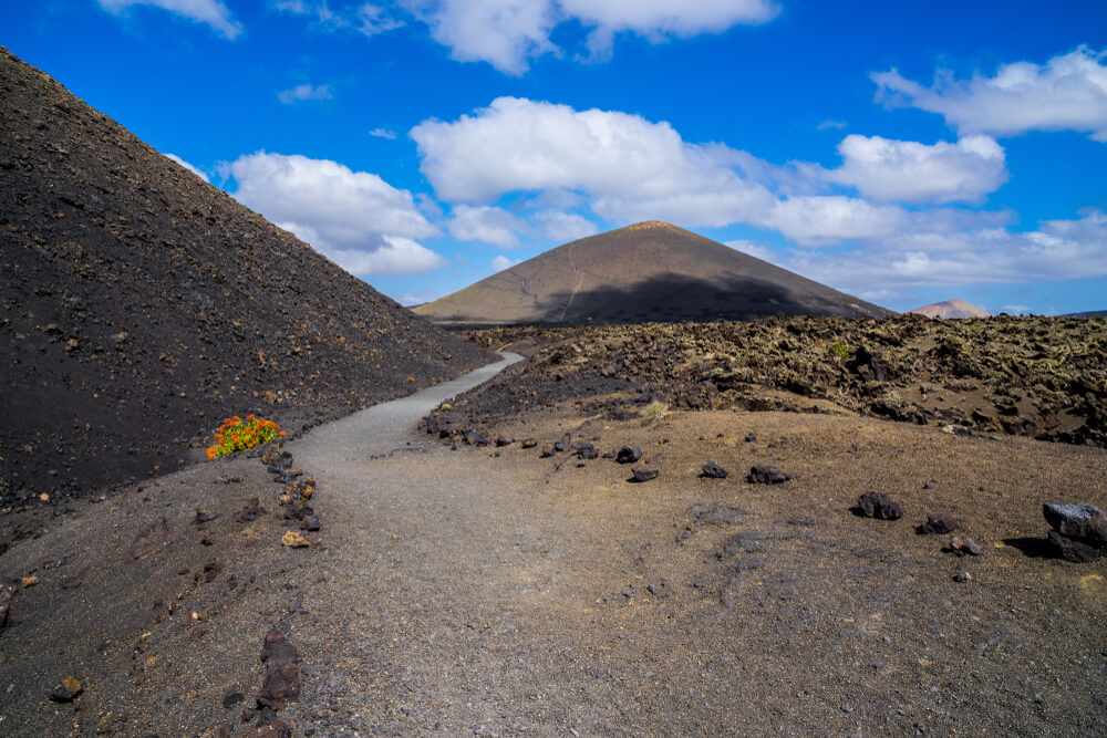 path leading through two Lanzarote volcanoes