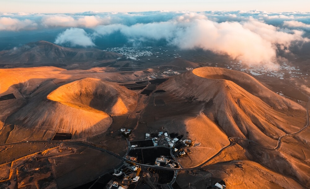 drone view of two volcano craters in Lanzarote