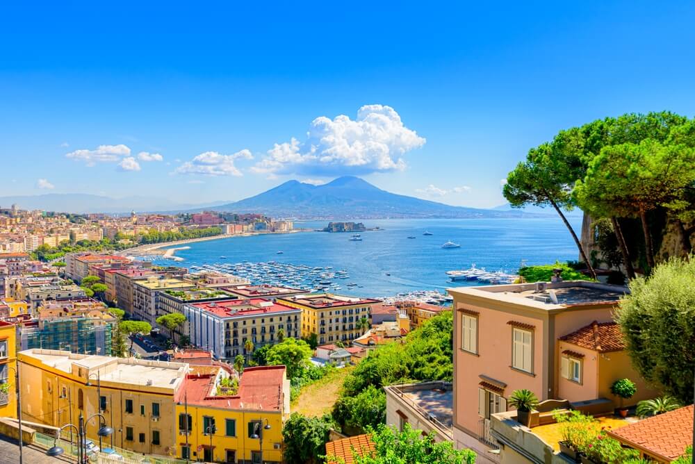 seaside town with volcano In Italy