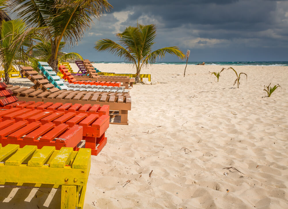 colorful lounge chairs in Playa Chen Rio