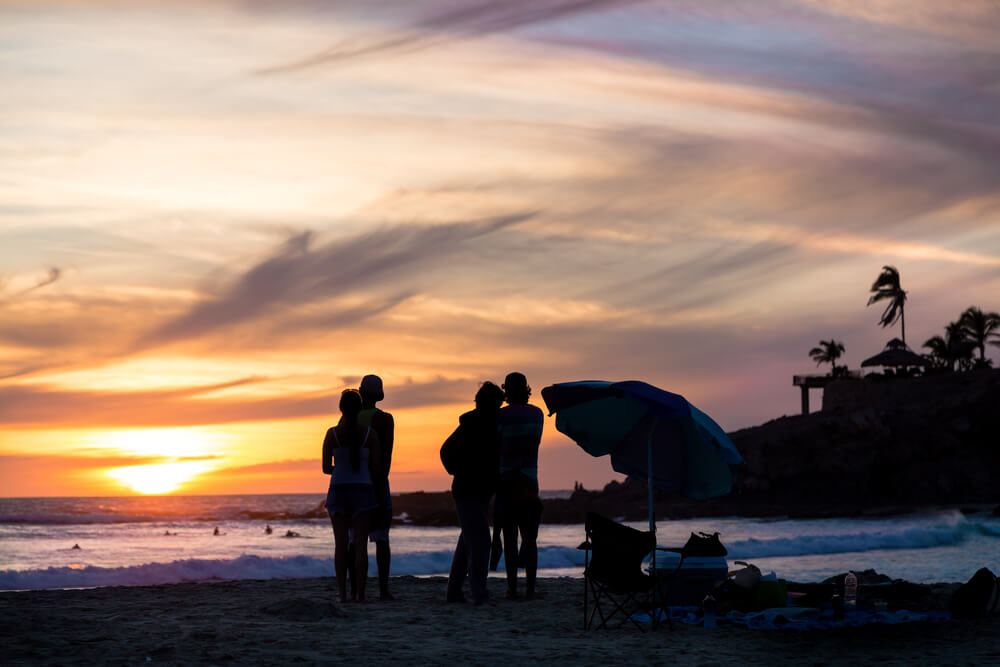 couples watching the sunet on the beach
