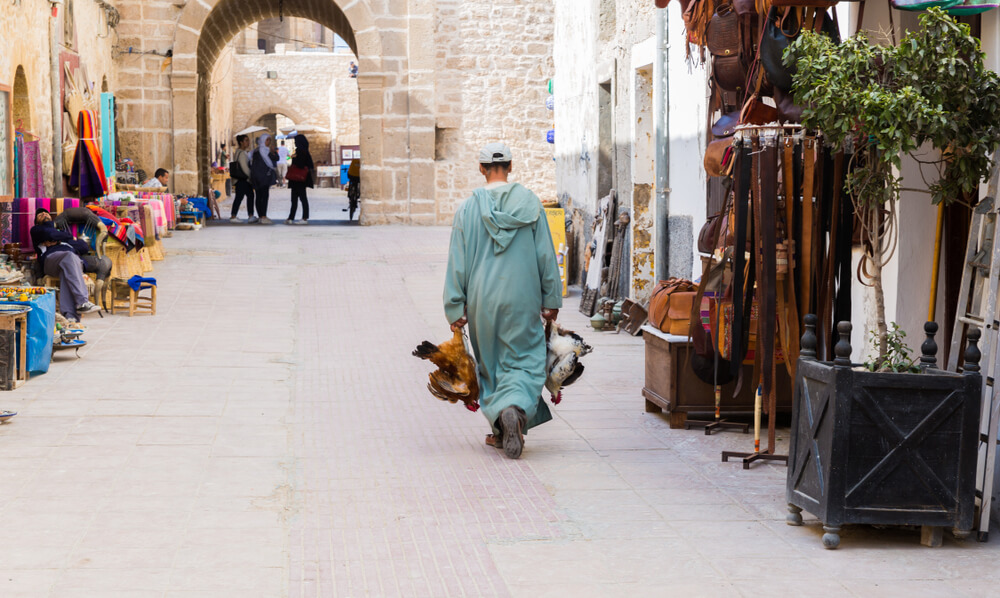 man with chickens in Morocco