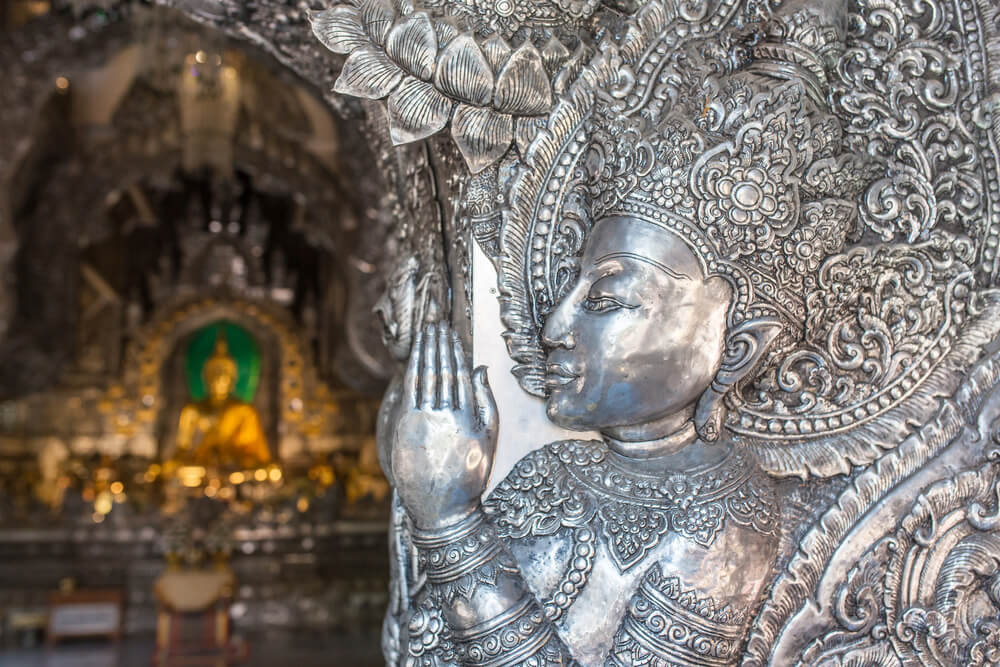 close up of a silver carving at temple in Southeast Asia 