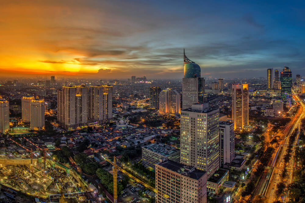 Jakarta Indonesia city skyline at sunset