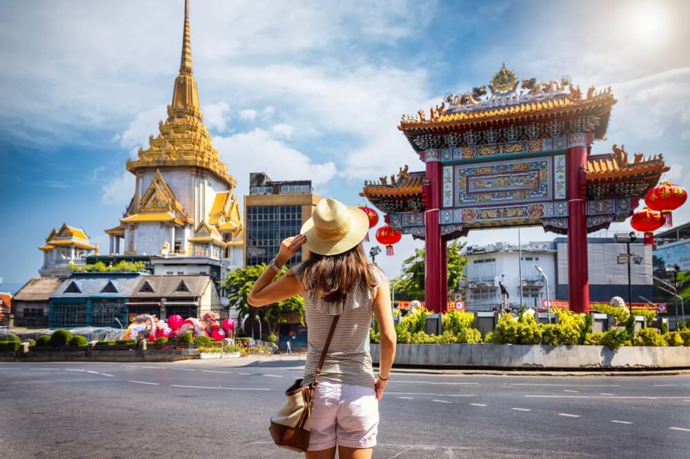 girl in front of temple in Thailand