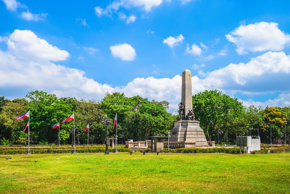 blue skies in park in Intramuros