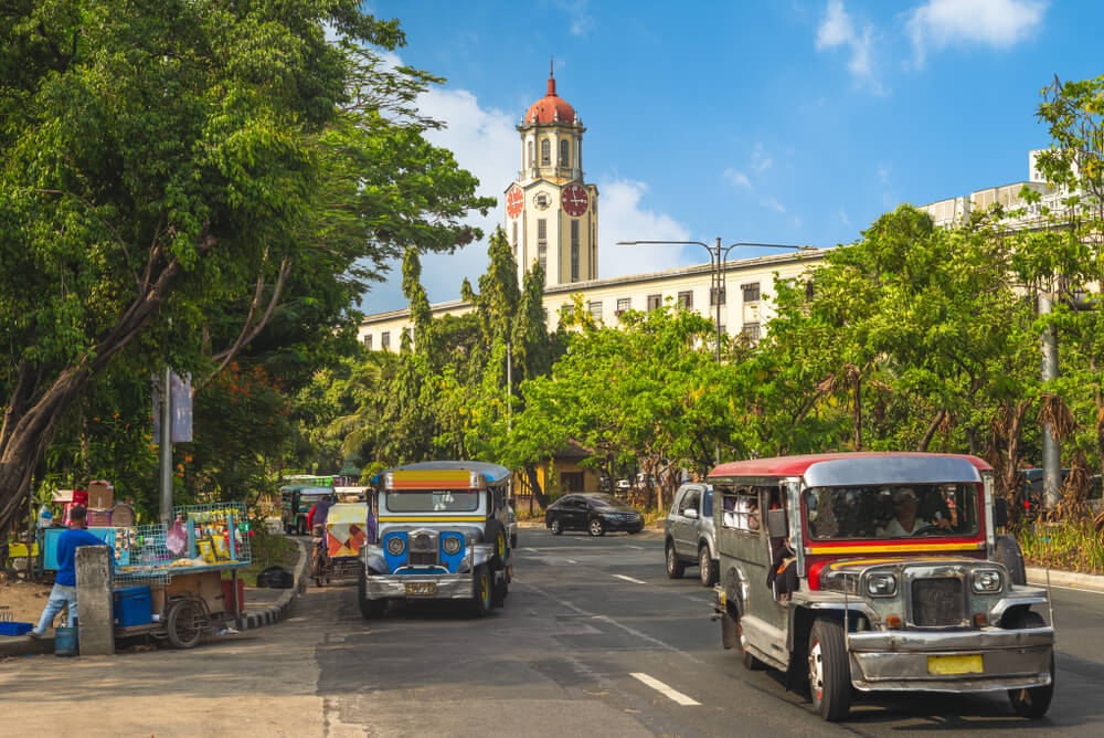 buses in front of Intramuros church in Manila