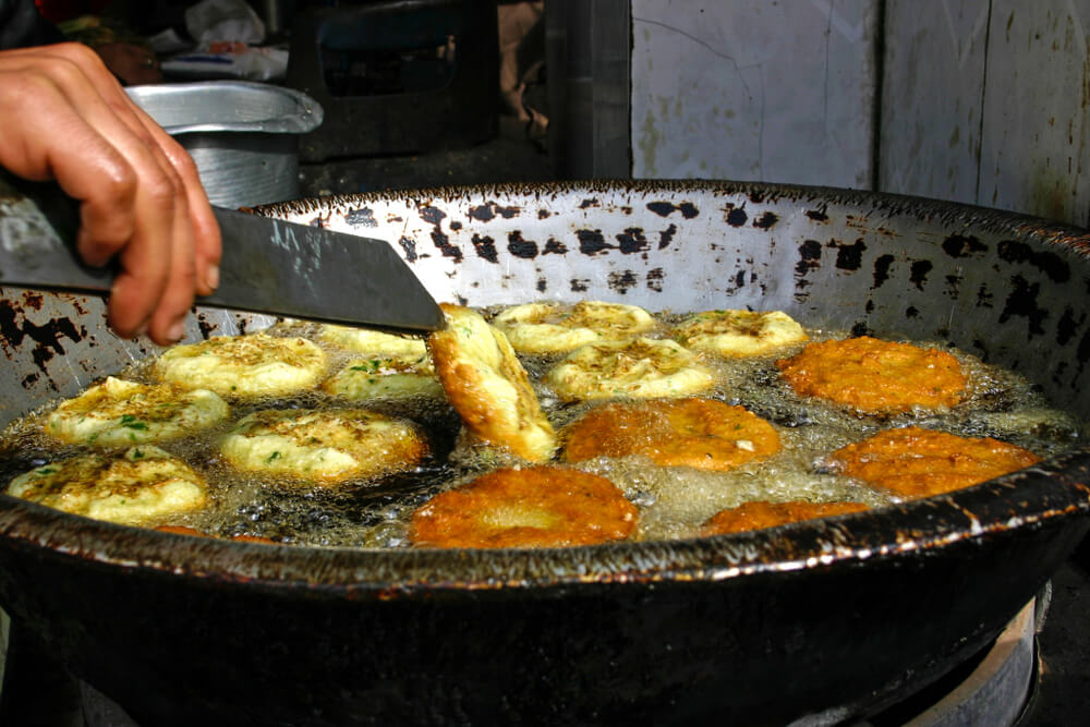 man frying felafel in Egypt